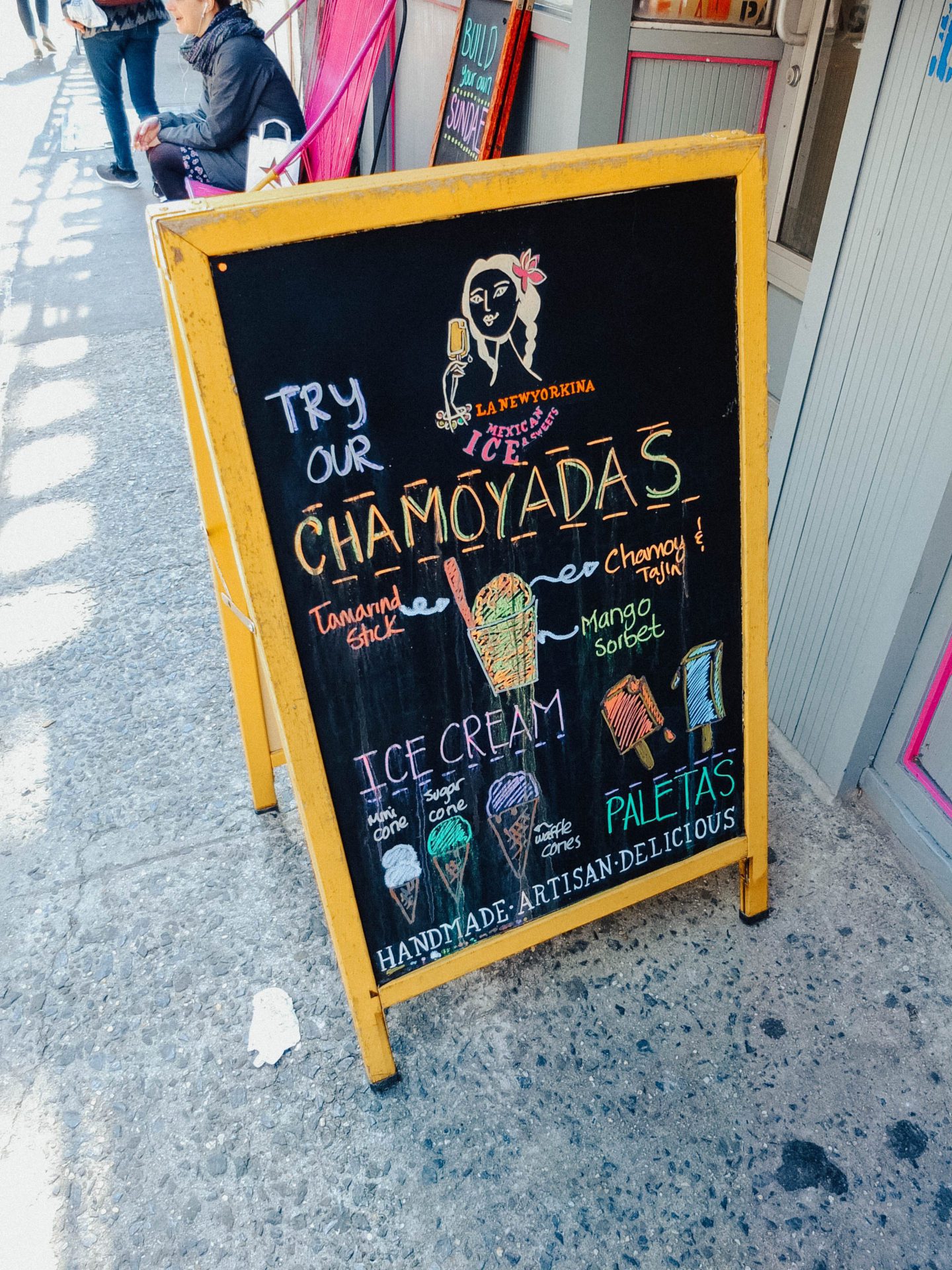 Shop chalk board sign with writing, New York City Food Tours