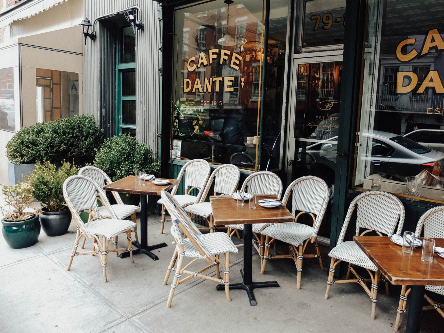 outdoor cafe setting with tables & chairs, New York City Food Tours