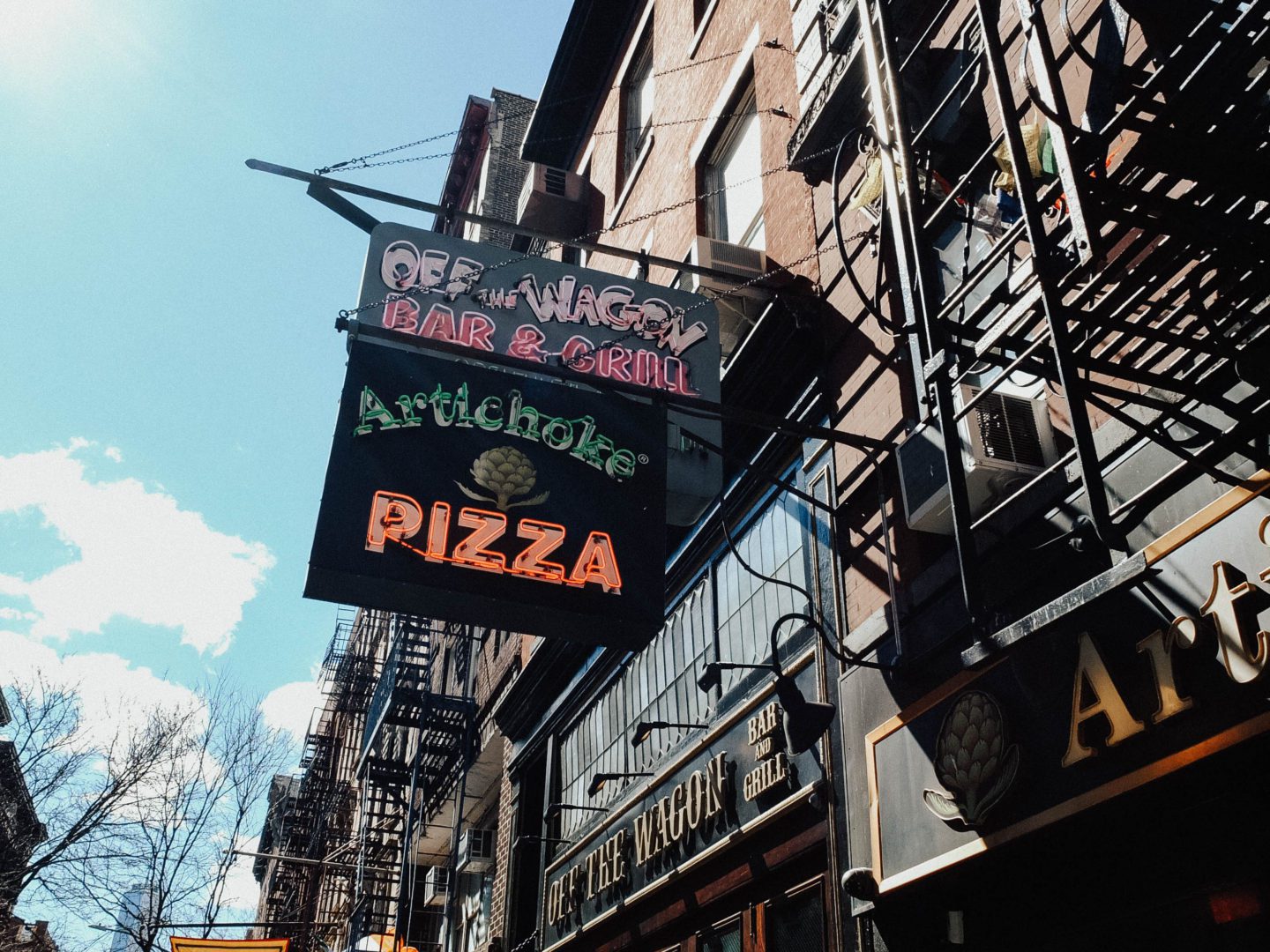 Artichoke pizza sign on a building 