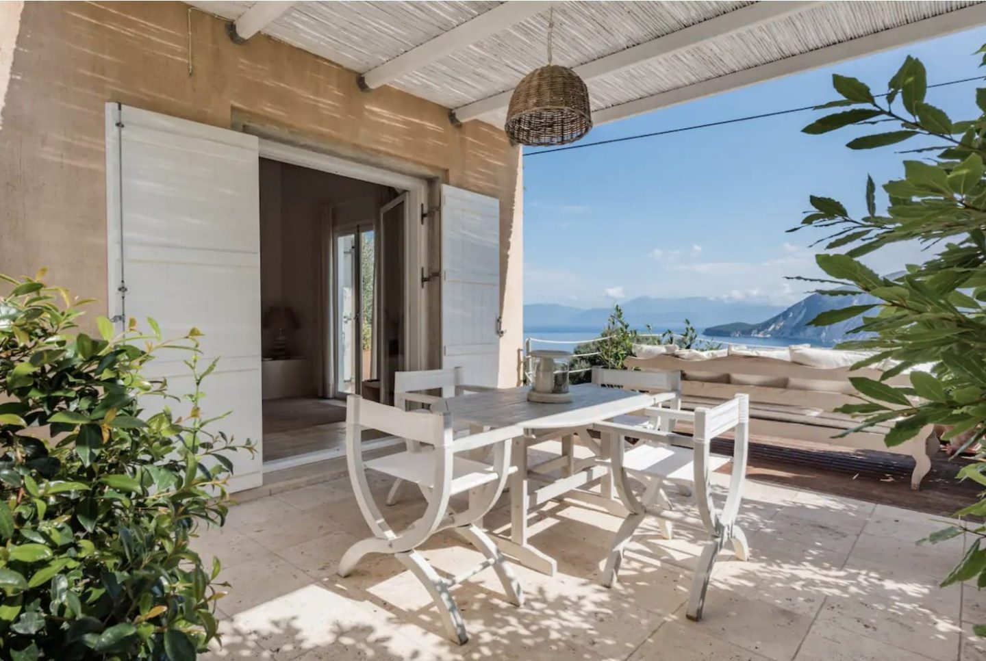 Outdoor paito overlooking a water view, dreamy Airbnb stays for under $100