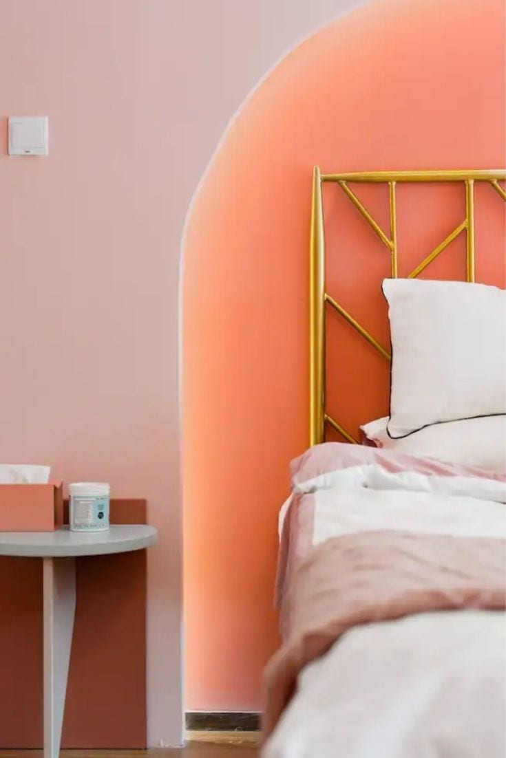 Pink bedroom with bedhead