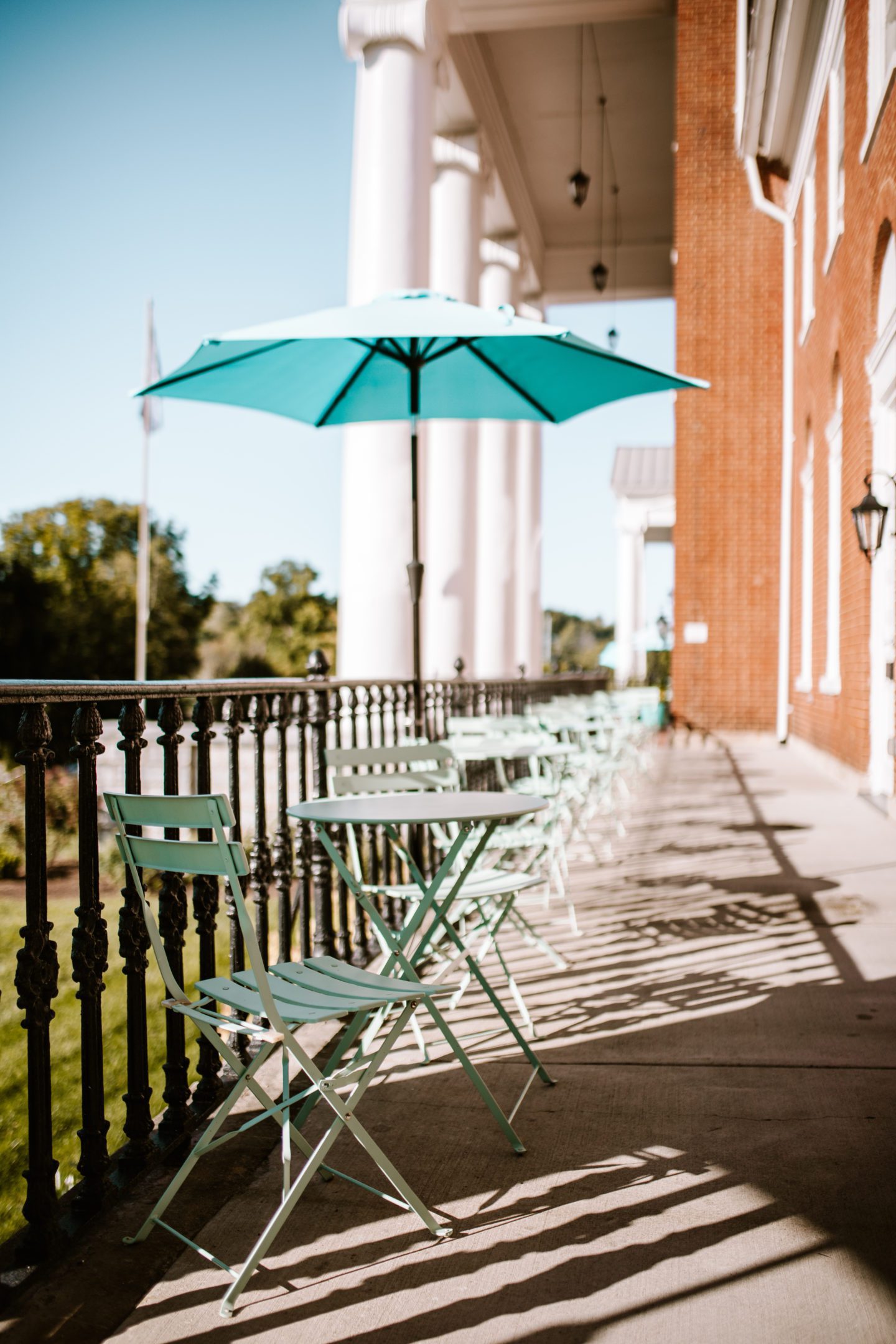 chairs & umbrella on a hotel patio 