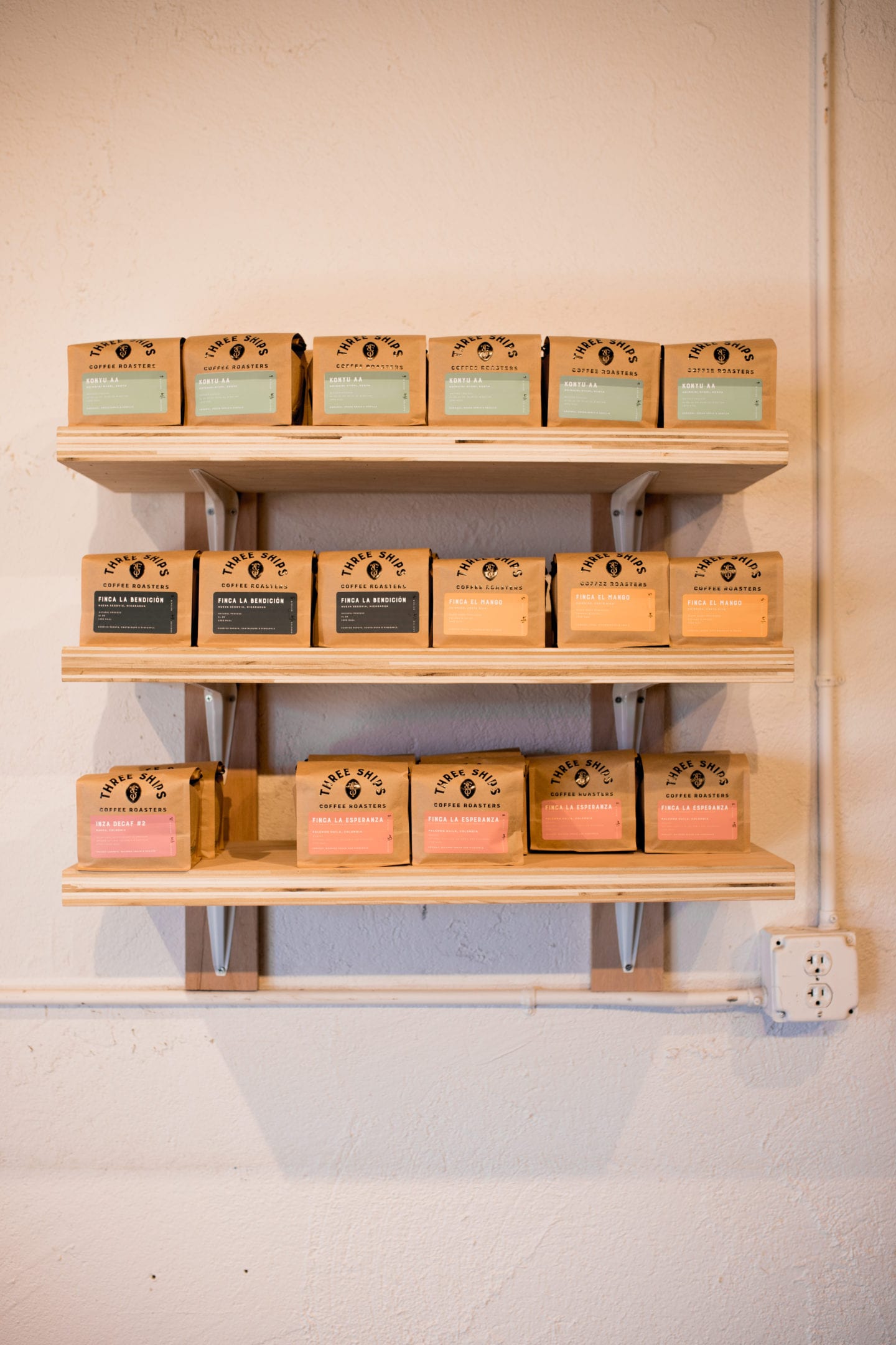 Shelf with coffee bags, Coffee Shops In Virginia Beach
