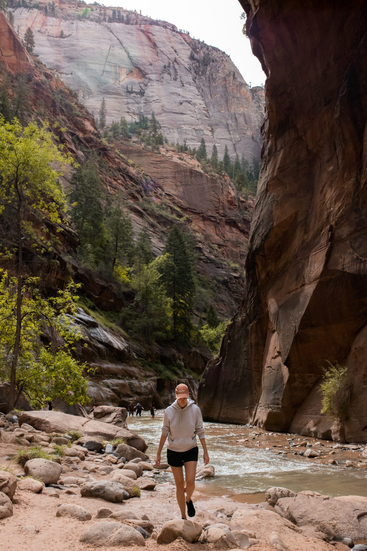 girl walking through narrow canyon walls, 2 week west coast USA itinerary