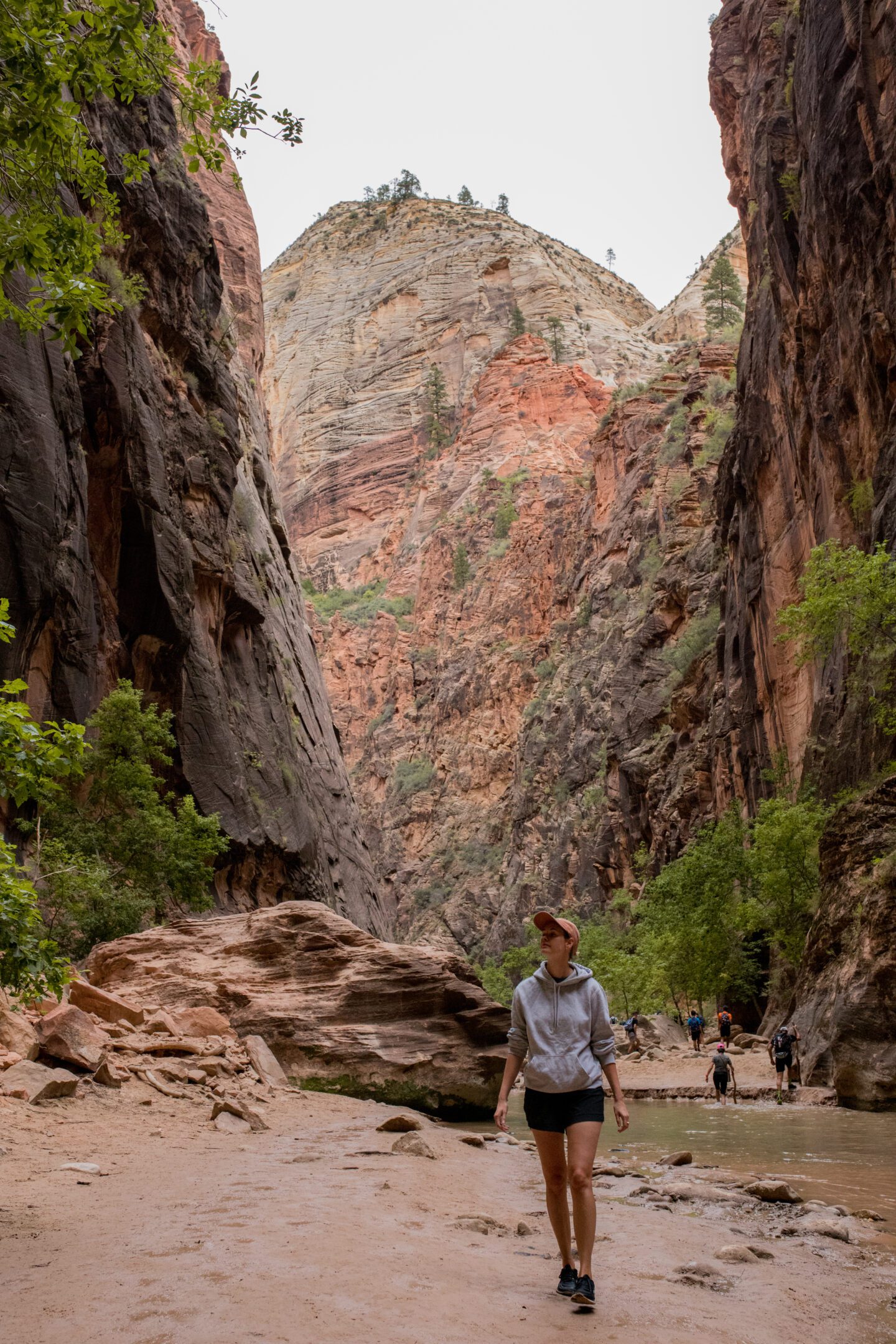 Girl walking through a canyon gorge 
