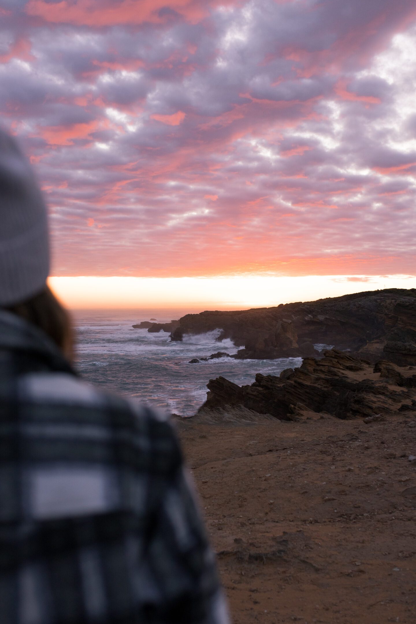 Girl looking at a colorful sunset, things to do in Warrnambool