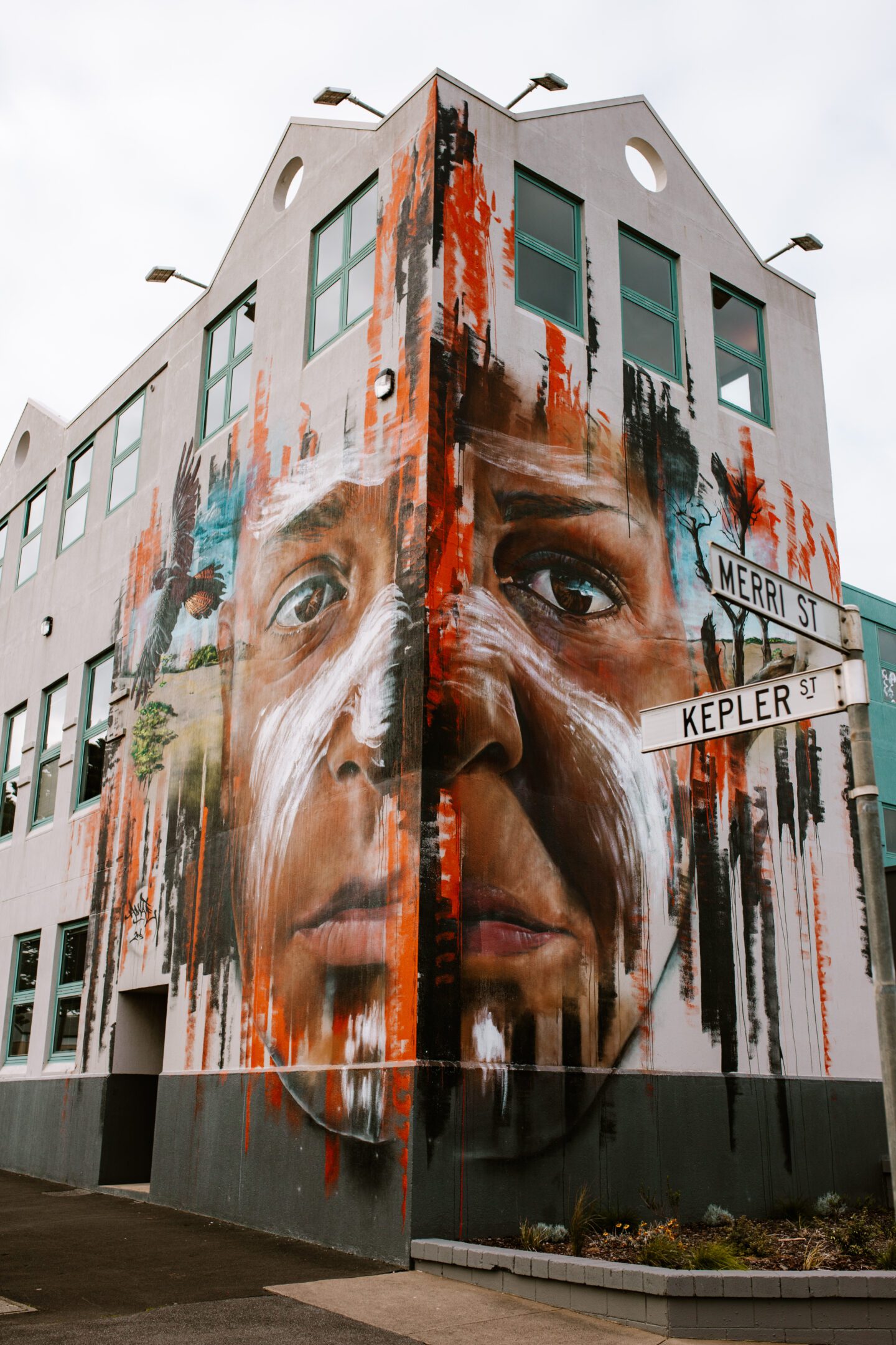A colorful mural on a brick building