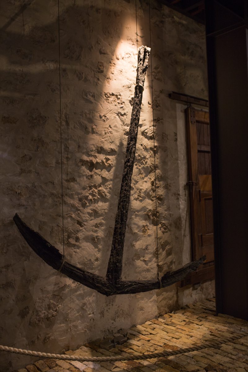 WA Shipwreck Museum, a large old rusted boat anchor displayed on a wall