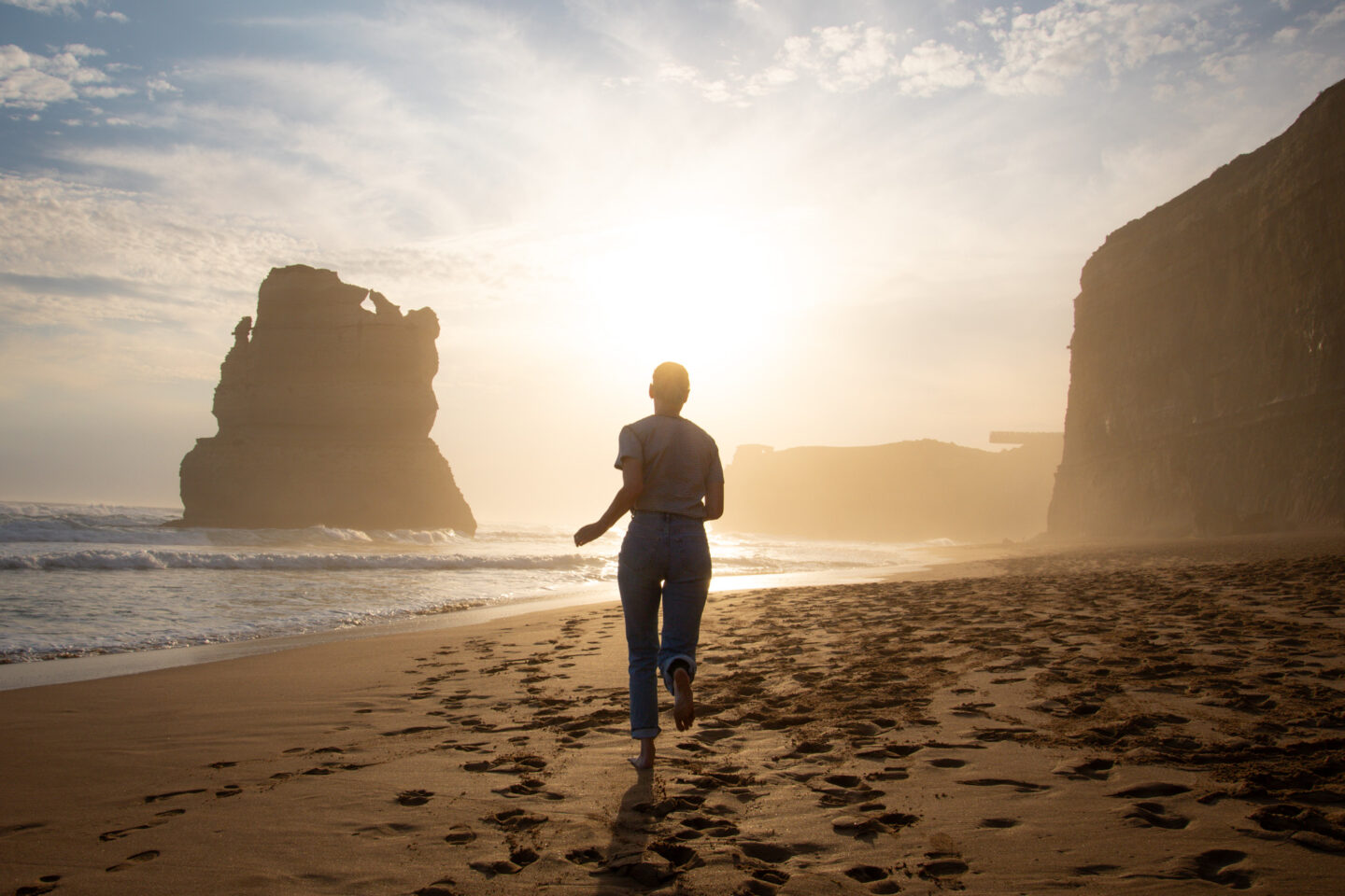 Great Ocean Road Day Trip, girl running towards a sunset on the beach
